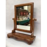 A mahogany swing toilet mirror