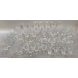 A large collection of cut glass including wines, flutes, brandy balloons, sherries, spirit tumblers,