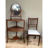 An early 19th century mahogany corner wash stand with later surface above an undertier fitted with a