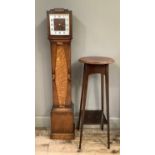 An Edwardian mahogany plant stand with circular top together with an oak grandmother clock having