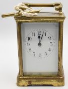 19th century French Carriage Clock, brass with white face, comes with key and works periodically,
