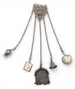 Chatelaine c1900 with chains of bell, tape measure, whistle, purse, stamp envelope