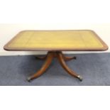 MAHOGANY CARD TABLE with green leather top featuring gold decorative border, raised on splayed