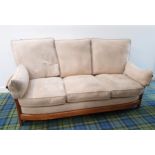 ERCOL 'RENAISSANCE' THREE SEAT SOFA design number 1068, with curved stick back support and raised on