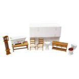 A collection of various boxed wooden and ceramic dolls house furniture, including upholstered sofas,
