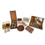 A collection of assorted vintage games including cards, a mother of pearl and wooden, ornate chess