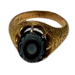 A Victorian 15ct yellow gold mourning ring, with floral-carved shank and eight-claw set with an oval