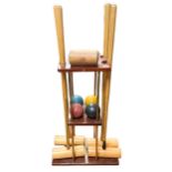 A good quality vintage croquet set, the four mallets with impressed makers marks for Army and Navy