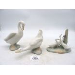 Three Nao duck ornaments.
