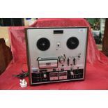 A vintage Akai GX-22OD reel to reel tape deck having glass and crystal ferrite head and twin VU