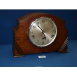 An 8 day mantle clock by Garrard with Westminster chime, in Napoleon hat shape,