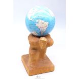 A hand-carved, possibly Lime wood depiction of Atlas supporting The Earth,