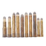 Early coiled brass ammunition, to include 2 x .577/450 coiled, 2 x .400 coiled, and 6 x .450 coiled.