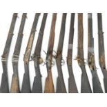 Ten flintlock and percussion muskets in relic condition, four with locks, including two Brown Bess