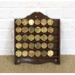 Automobilia Interest Display of Thirty Cast and Stamped Brass Fuel Caps