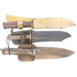 Three knives and scabbards, to include a Wilkinson survival knive, a US fighting knife and a WWII