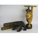 A polychrome decorated wood stand in the form of a frog, 48cm high, a carved wood figure of a bear