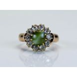 A Victorian cat's eye chrysoberyl and old cut diamond cluster ring in a high carat precious yellow