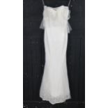 Ivory lace mermaid bridal gown with sweetheart neckline, laced back, applied lace body with rose