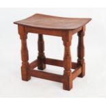 Robert 'Mouseman' Thompson, Kilburn - a mid 20th century oak stool, the adzed rectangular top raised