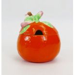 A Clarice Cliff pottery marmalade jar and cover, in the form of an orange, 11cm high.