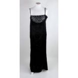 An Art Deco period lady's slip dress / petticoat, in black silk with lace neckline, c. 1920, approx.