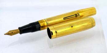 A Conway Stewart gold fountain pen with 9ct gold nib, cased.