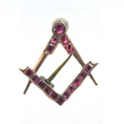 A Georgian Masonic pin set with red stone, approx 1.6g.