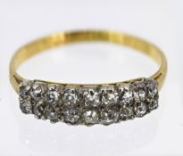 A two row diamond ring, set with eighteen diamonds, set in yellow gold, approx 2.9g, size U.