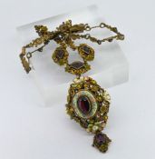 An interesting large antique enamel gem set necklace set with garnet and pearl, marked sterling.