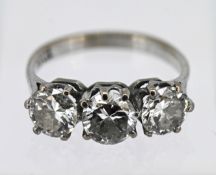 A three stone diamond ring, set in 18ct white gold, centre stone approx 1ct, two end stones approx