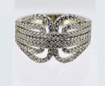 A silver belt-style dress ring set with over 140 white cubic zirconia, approx 5.6g, size O.