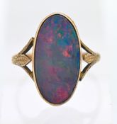 An Edwardian large opal dress ring, stone size approx 17mm x 7mm, set in 9ct yellow gold