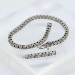 A diamond-set tennis bracelet, mounted in 14ct white gold, set with approximately 53 diamonds, total