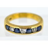 A seven-stone diamond and sapphire half-eternity ring, channel-set in 18ct yellow gold. Size N/O.