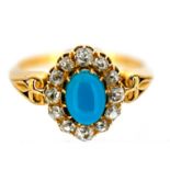 A Victorian turquoise and diamond cluster ring, claw set to the centre with an oval turquoise