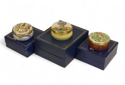 Three Halcyon Enamelled hinged pill boxes to feature designs of 'Edwardian Court Dancers', 'Tiger in