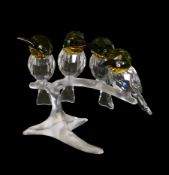Swarovski Crystal Birds, four Bee Eaters with Black Beaks/Yellow Throats perched on a frosted