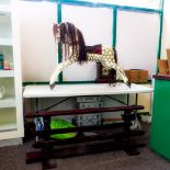 In the manner of F H Ayres, a vintage carved wooden rocking horse, with dapple grey painted body,