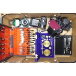 A mixed collection to include:- Geometry Set, Weighing scales with weights, boxed cutlery set with