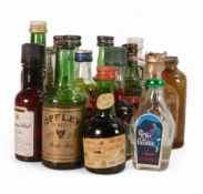 A Collection of Whiskey and Alcohol Miniatures to include Courvoisier Cognac, Poires William,