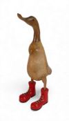 Large wooden Standing Duck wearing red laced boots. H:-50cm
