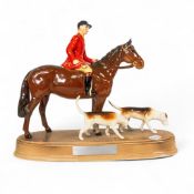 Beswick model of a Huntsman and Hounds on an oval base, titled Working A Line.