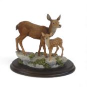 Country Artists 'A Brief Rest' CA937, Doe and Fawn on wooden plinth. H:-20cm, boxed.