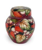 Moorcroft small Ginger Jar 'Winter Harvest' pattern on burgundy ground, designer Anji Davenport.