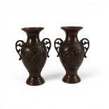 A pair of Chinese Bronze Urn shaped vases, both decorated with embossed birds and flowers, height