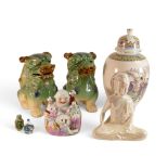 A group of Oriental style ceramics to include a near pair of green glazed Foo Dogs, a small buddha