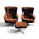 A vintage pair of mid-century brown corduroy swivel egg armchairs and a matching stool.