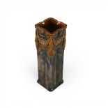 A Royal Doulton Lambeth Ware vase , Art nouveau in style , with embossed floral swags from the top