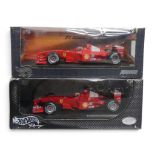 Hot Wheels 1:18th scale diecast F1 cars, Michael Schumacher, Ferrari F2000 & F2001, boxed. (2)